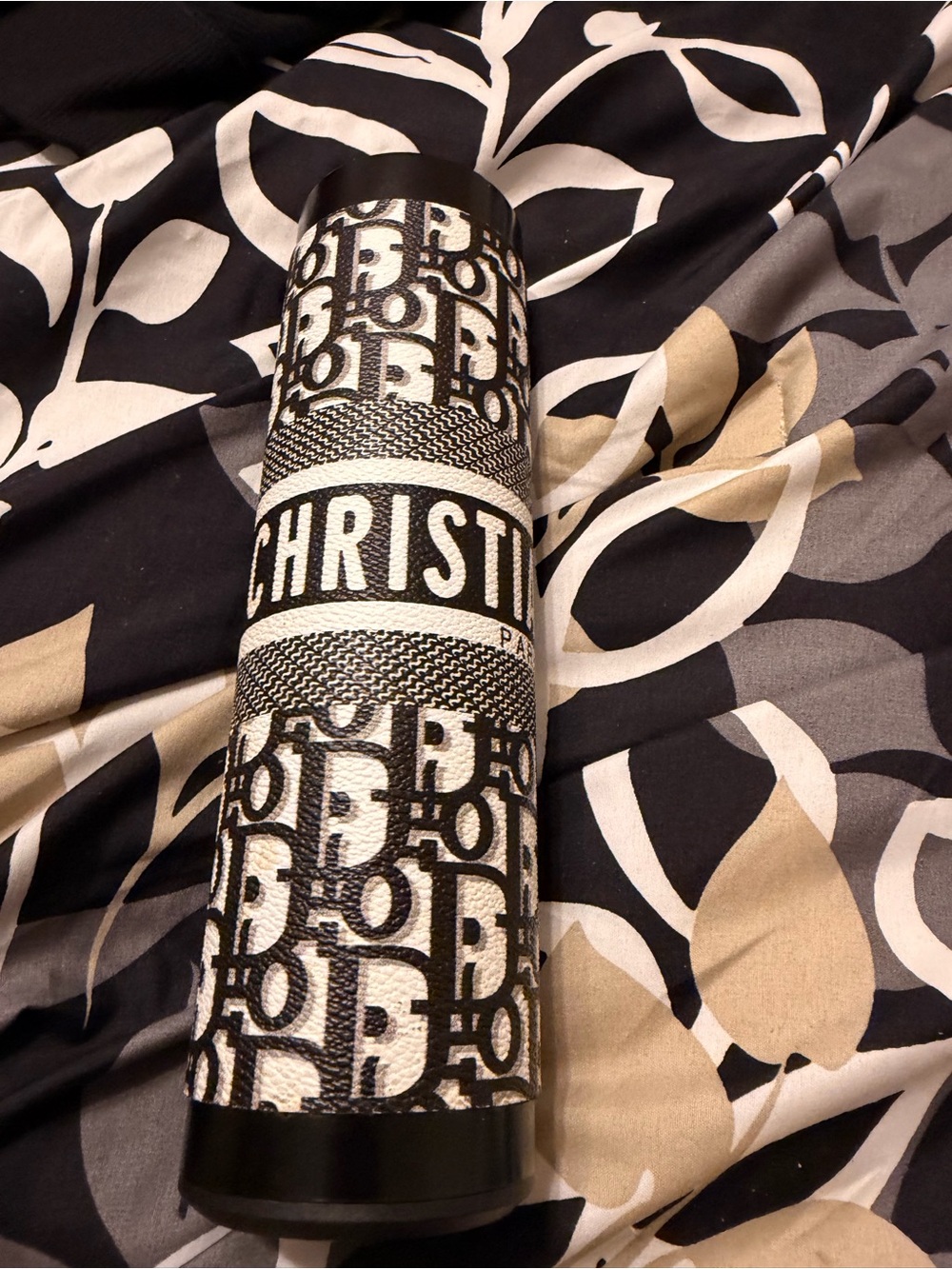 Christian Dior Black & White Monogram Tumbler

It’s a sleeve that comes on off